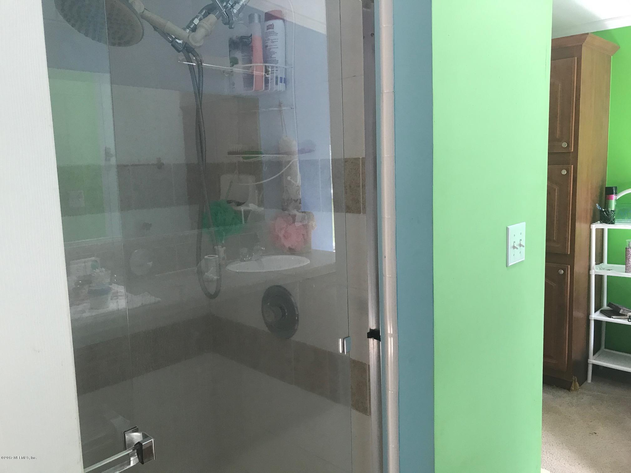 3581 Stratton Road Jacksonville, FL 32221 - Photo 11 of 14 a bathroom with a shower