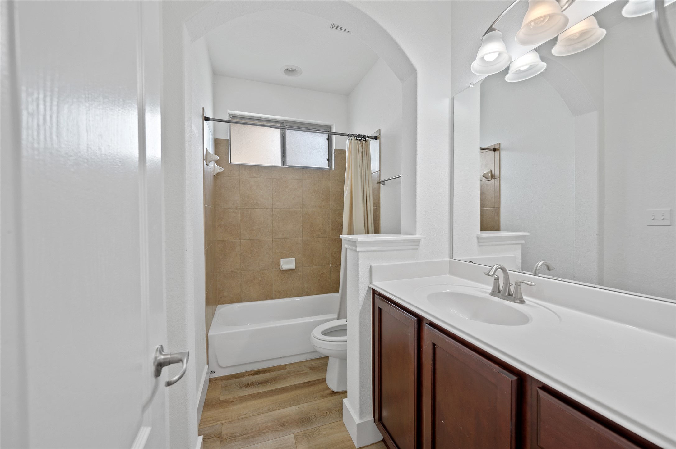 4512 Pyrenees Pass Bee Cave, TX 78738 - Photo 24 of 35 a bathroom with a sink a toilet and shower