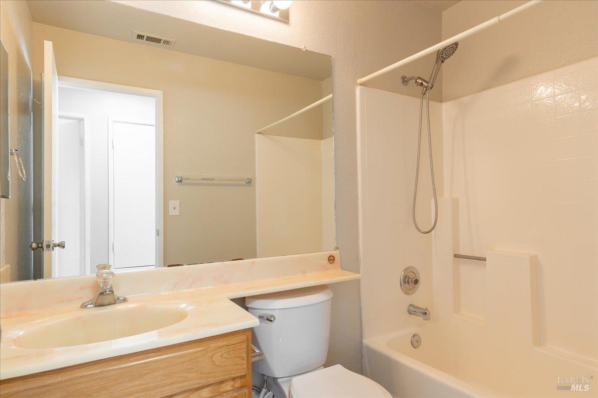 987 Daniel Street Fairfield, CA 94533 - Photo 18 of 36 a bathroom with a sink toilet and shower