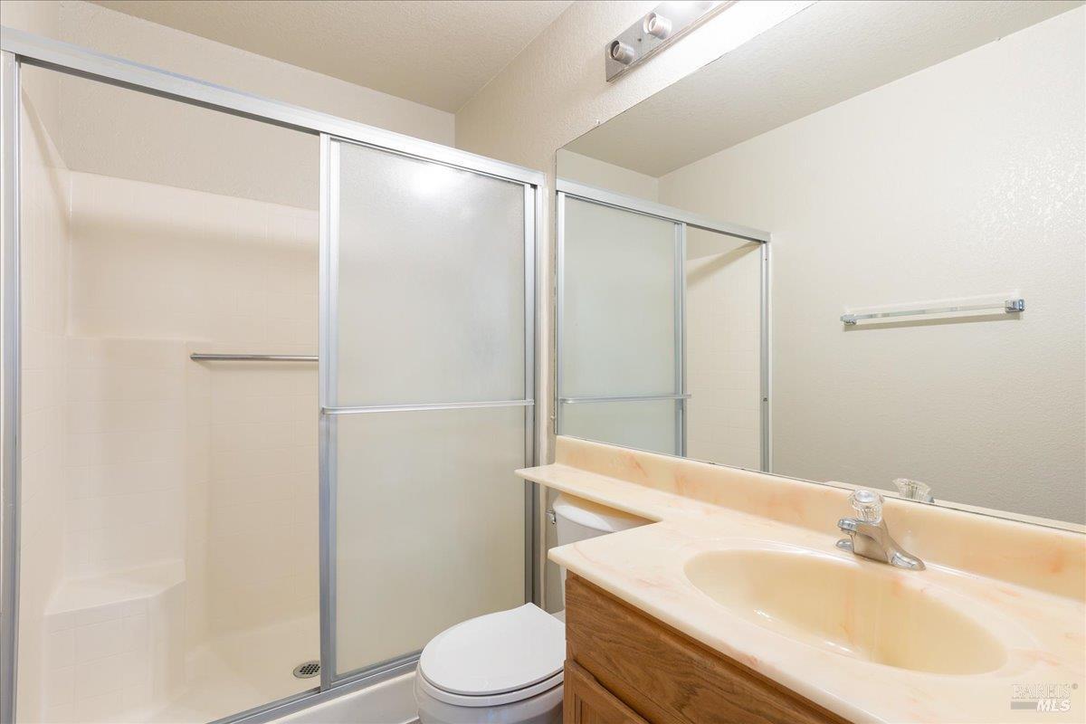 987 Daniel Street Fairfield, CA 94533 - Photo 19 of 36 a bathroom with a sink a toilet and shower
