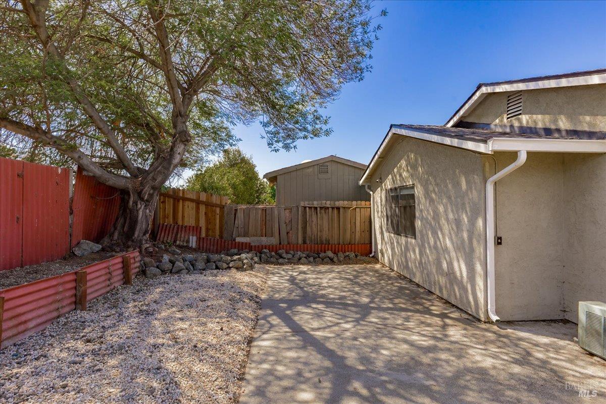 987 Daniel Street Fairfield, CA 94533 - Photo 23 of 36 a view of a small house with wooden fence