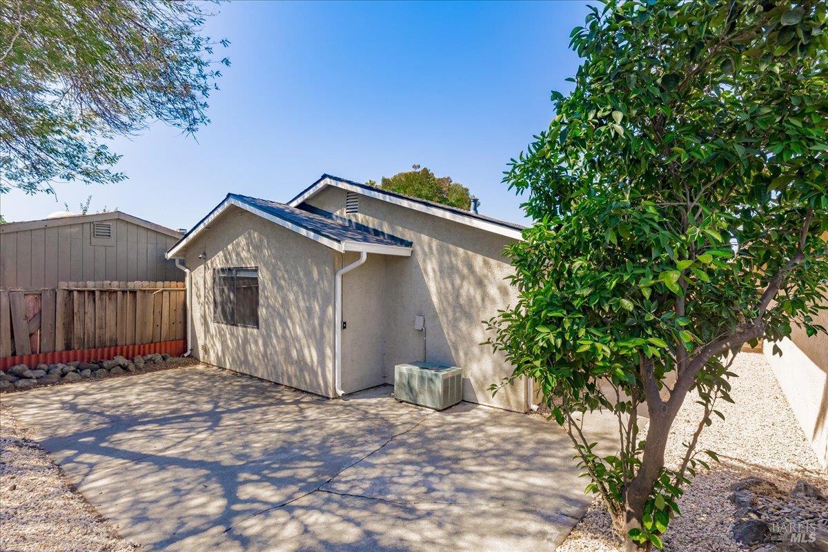 987 Daniel Street Fairfield, CA 94533 - Photo 24 of 36 a front view of a house with a yard and garage