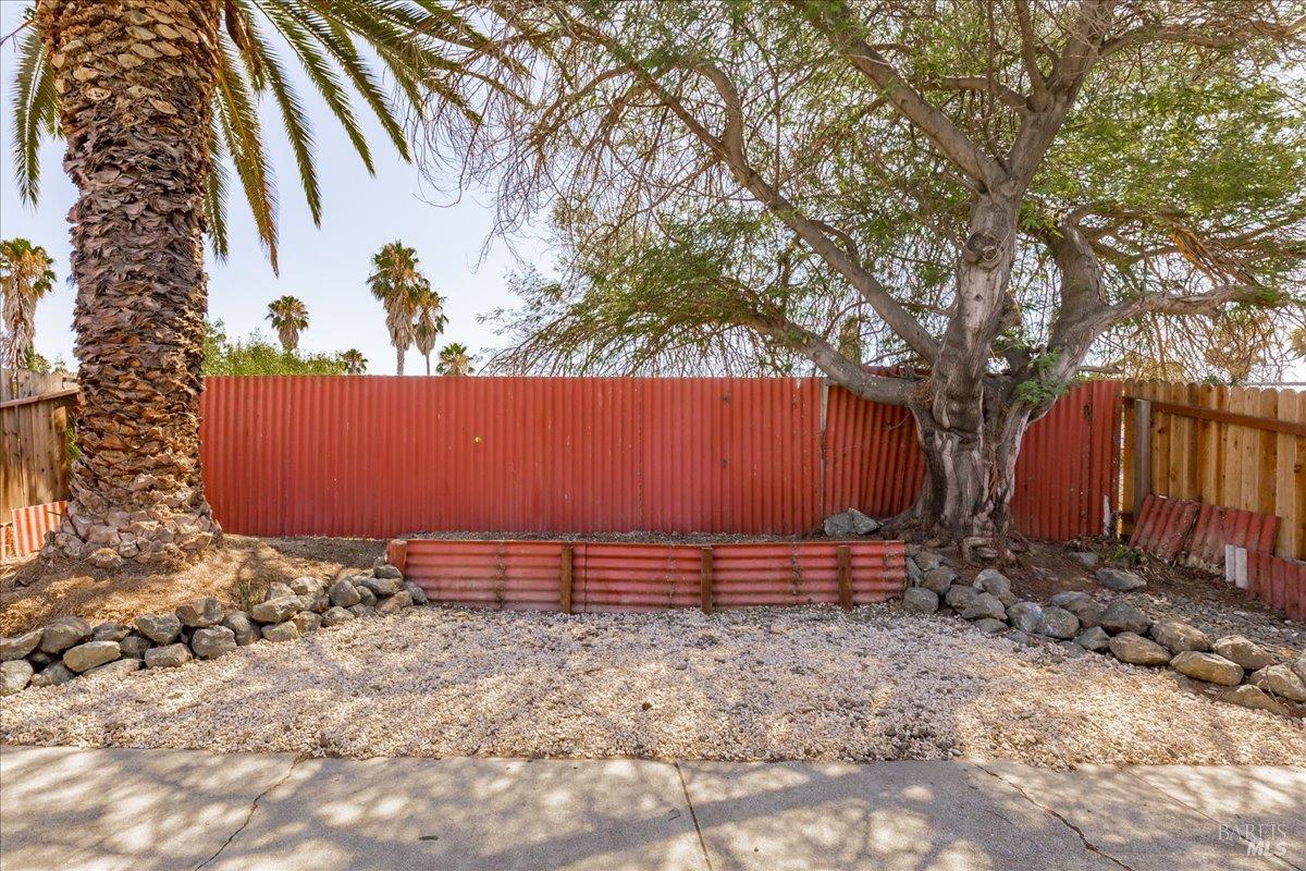 987 Daniel Street Fairfield, CA 94533 - Photo 30 of 36 a view of a wooden fence with large trees