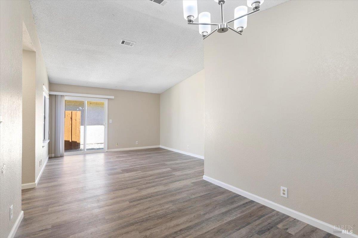 987 Daniel Street Fairfield, CA 94533 - Photo 10 of 36 wooden floor in an empty room