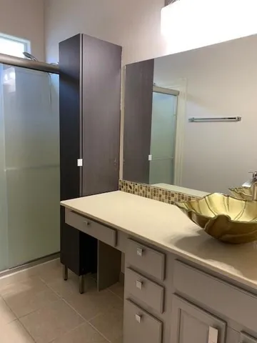 a bathroom with a sink and a mirror