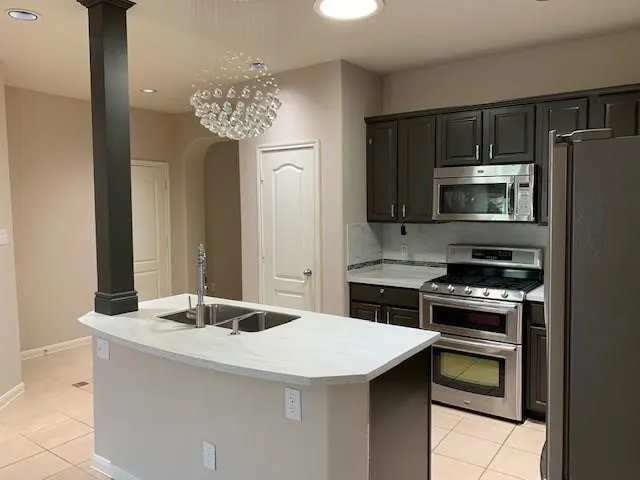a kitchen with a stove and a microwave