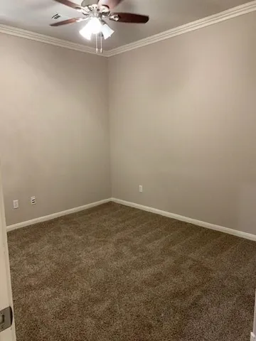 a view of a room with a fan