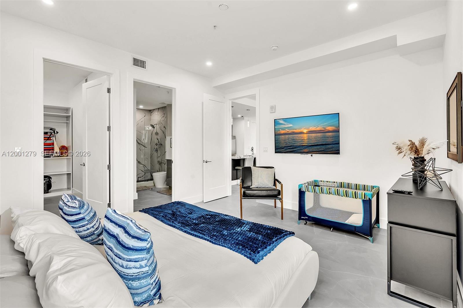 2100 Miami Road, Unit 403 Fort Lauderdale, FL 33316 - Photo 17 of 44 a bedroom with furniture and a flat screen tv