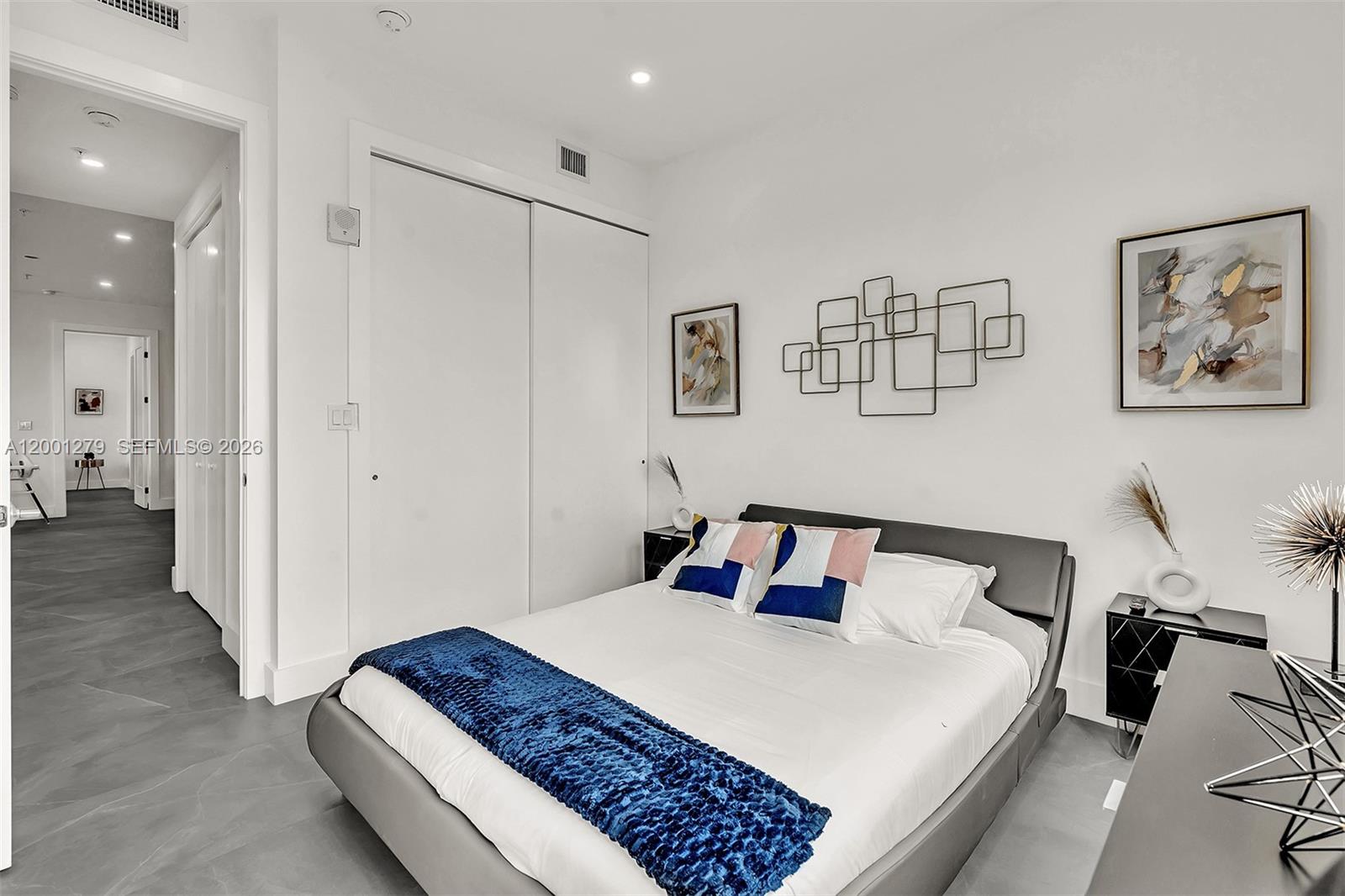 2100 Miami Road, Unit 403 Fort Lauderdale, FL 33316 - Photo 23 of 44 a bedroom with a bed and a view of bathroom