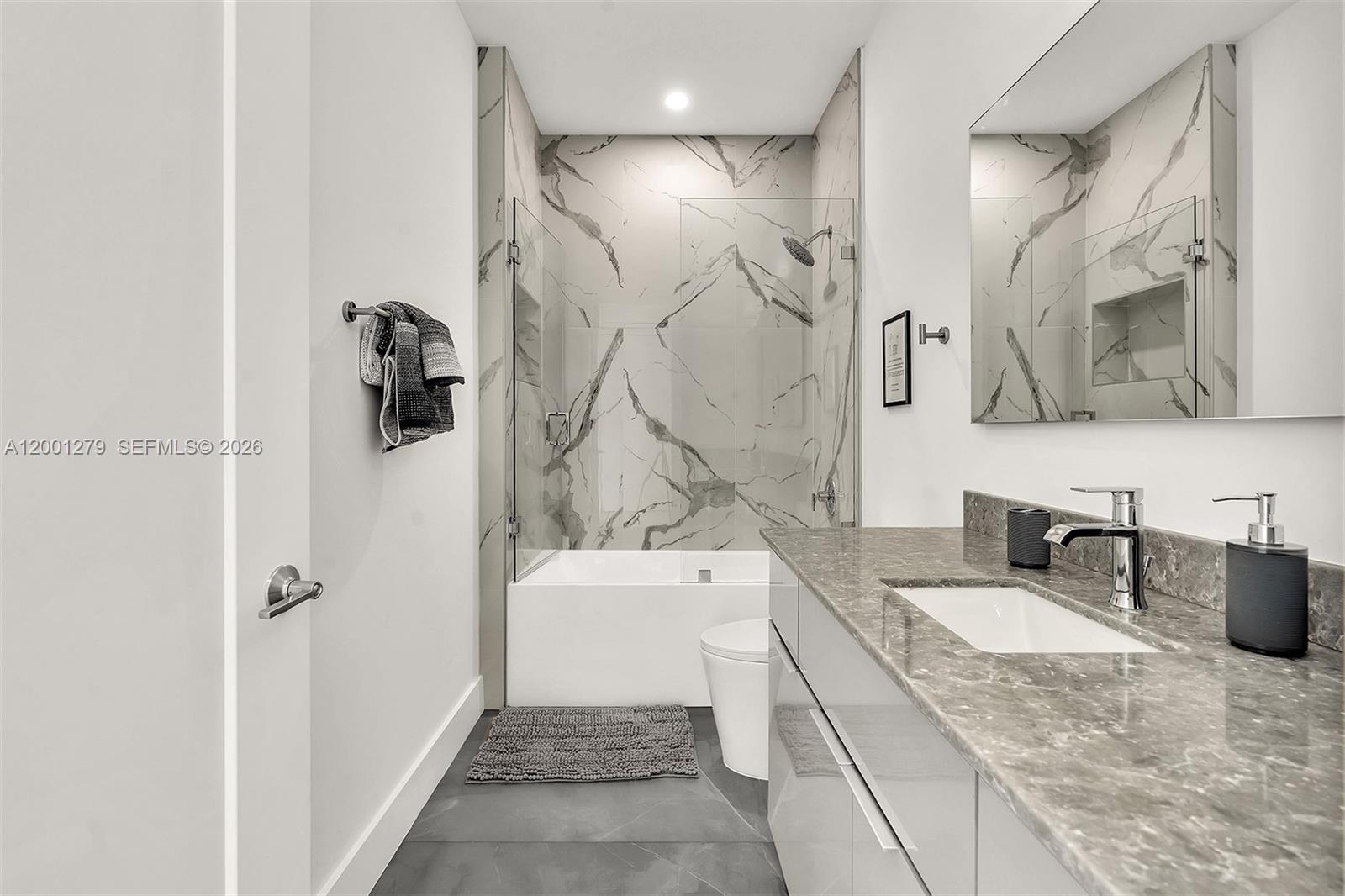 2100 Miami Road, Unit 403 Fort Lauderdale, FL 33316 - Photo 24 of 44 a bathroom with a sink a toilet and shower