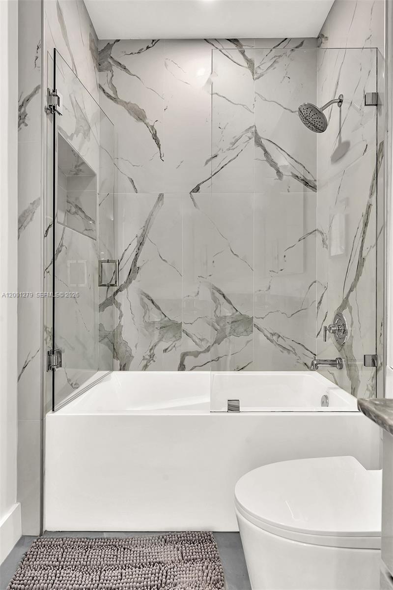 2100 Miami Road, Unit 403 Fort Lauderdale, FL 33316 - Photo 26 of 44 a bathroom with a toilet and a bathtub