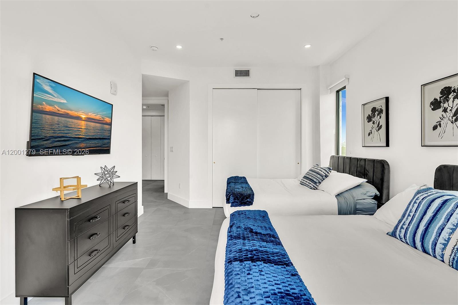 2100 Miami Road, Unit 403 Fort Lauderdale, FL 33316 - Photo 30 of 44 a living room with furniture and a flat screen tv