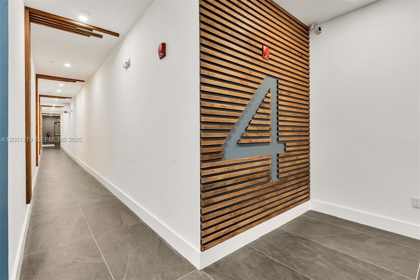2100 Miami Road, Unit 403 Fort Lauderdale, FL 33316 - Photo 35 of 44 a view of a hallway with wooden floor