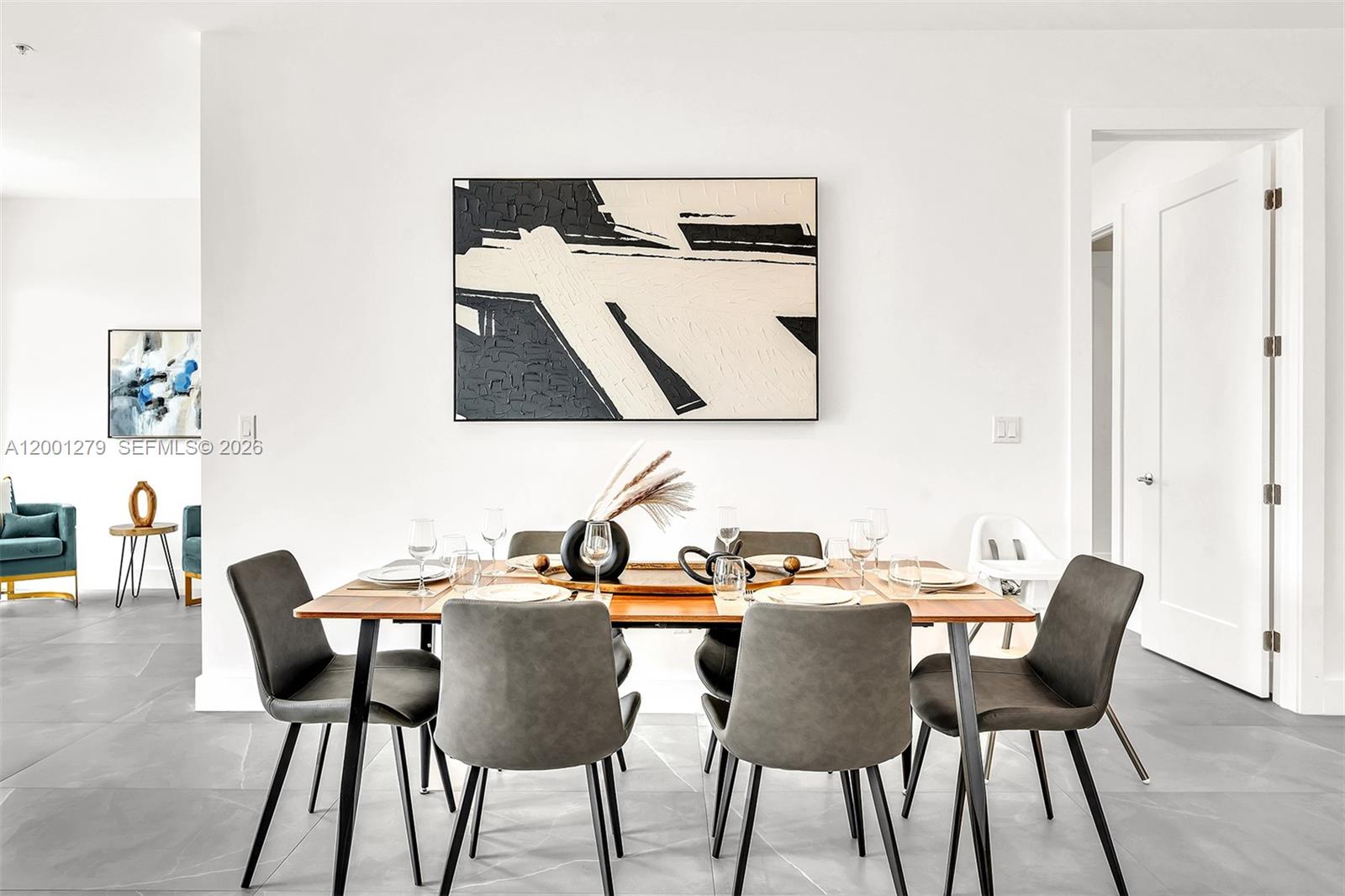 2100 Miami Road, Unit 403 Fort Lauderdale, FL 33316 - Photo 8 of 44 a view of a dining room with furniture and wooden floor