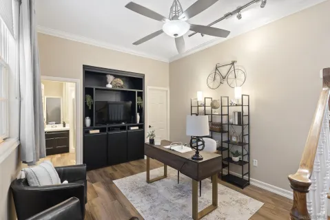 a living room with furniture and a flat screen tv