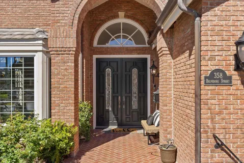 a view of front door of house with outdoor seating