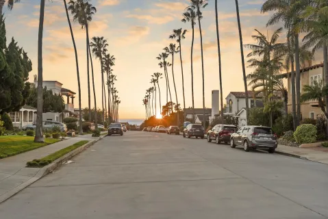 a view of a street with cars on road