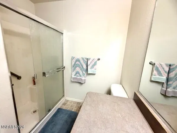 a bathroom with a tub and shower