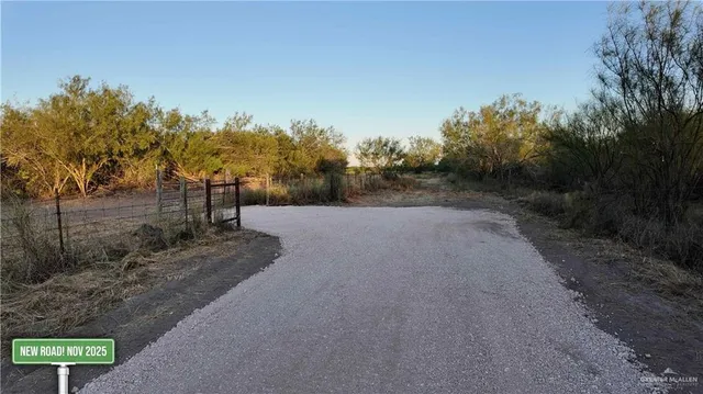 a view of a road with a yard