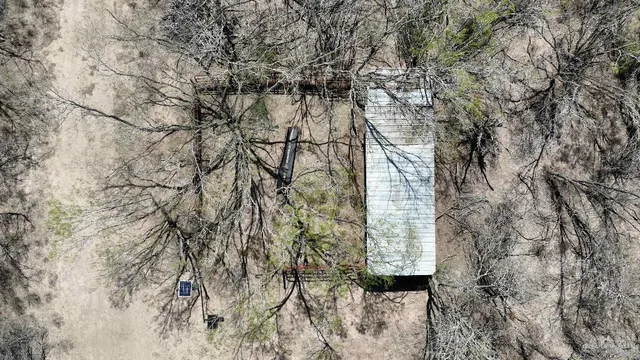 a view of wooden fence and a bench