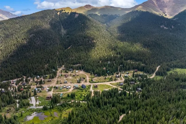 a view of a town with mountains in the background