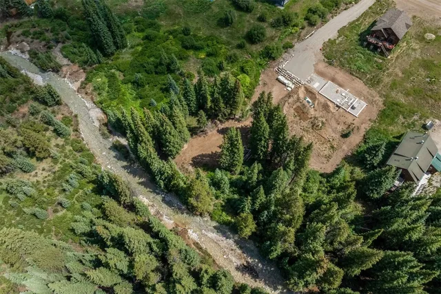 an aerial view of a house with a yard