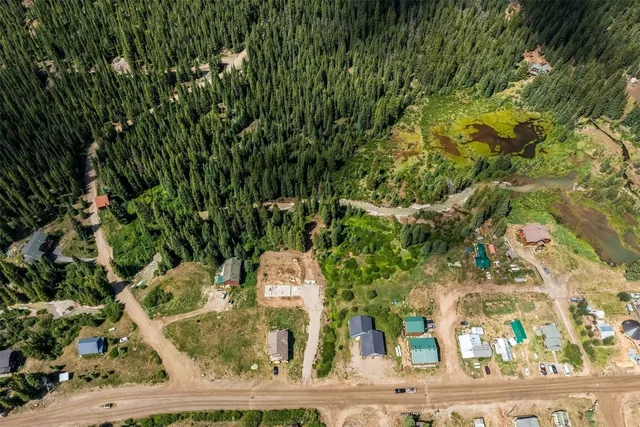 front view of a house with a tree
