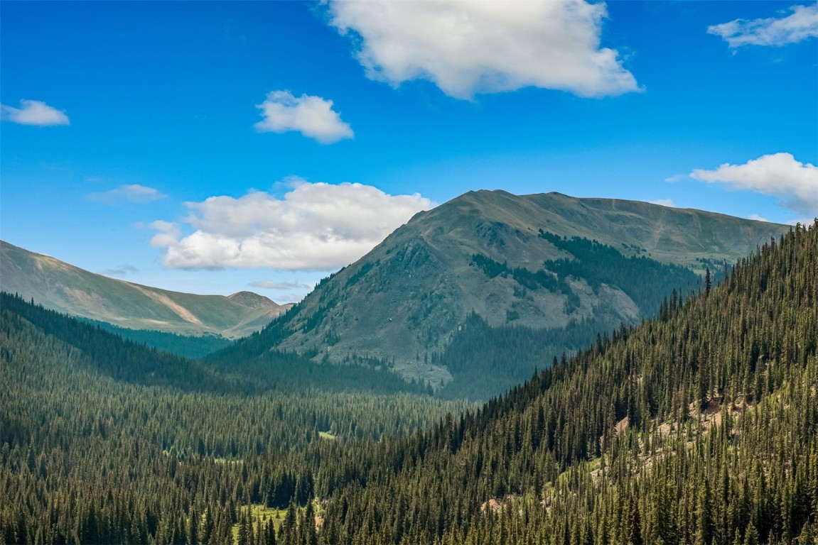 5400 Montezuma Road Montezuma, CO 80435 - Photo 31 of 31 a view of a lake in middle of a field