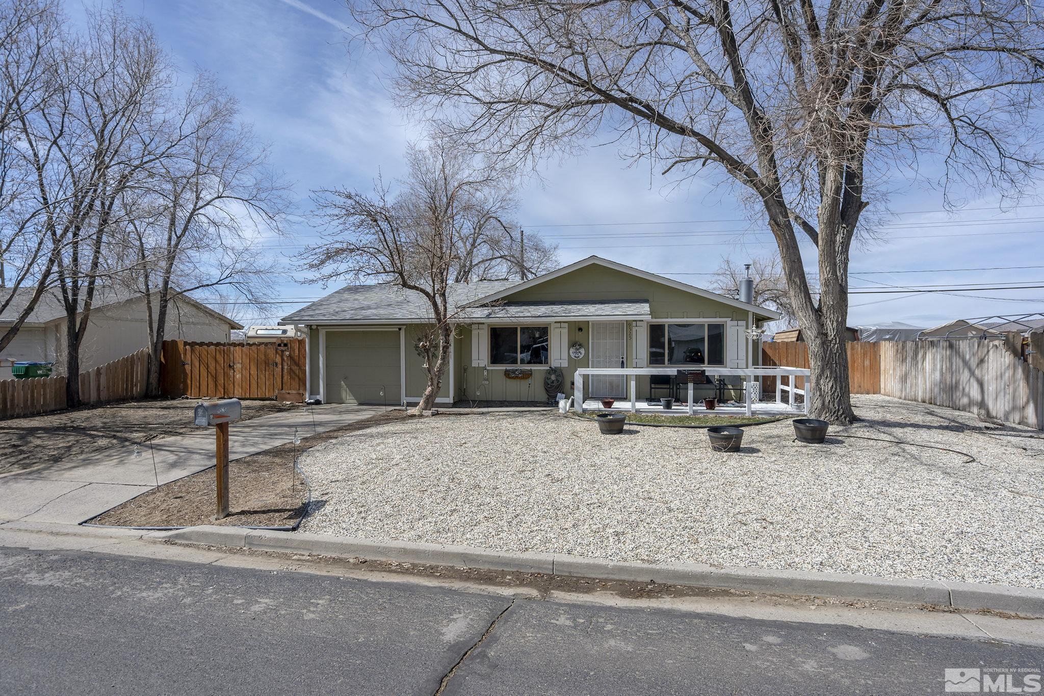 9525 Fremont Way Reno, NV 89506 - Photo 1 of 23 a front view of a house with yard and sitting area