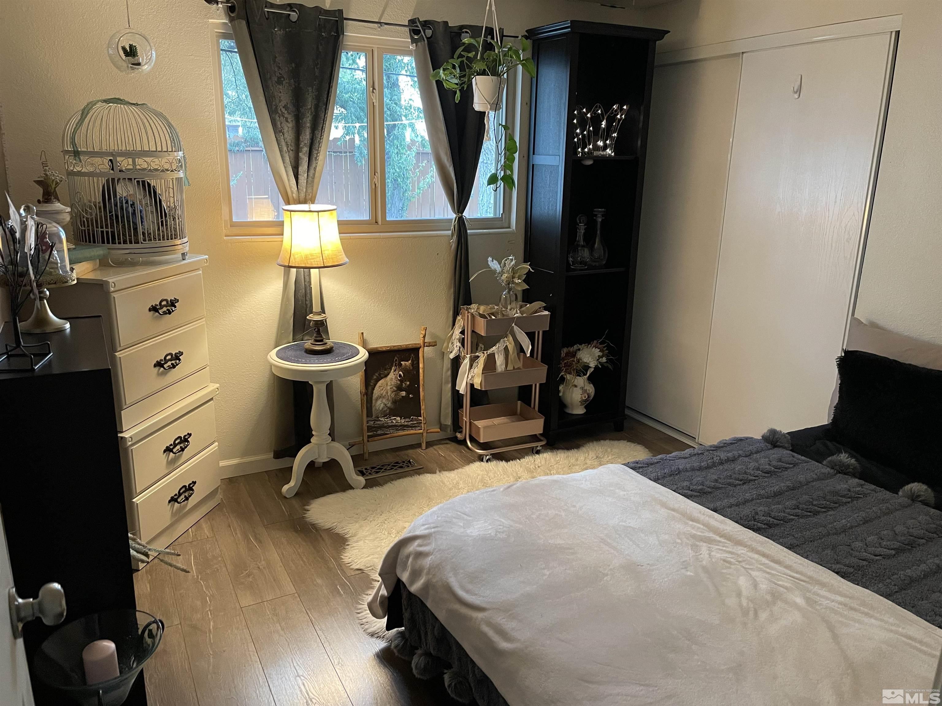 9525 Fremont Way Reno, NV 89506 - Photo 17 of 23 a bedroom with bed and wooden floor