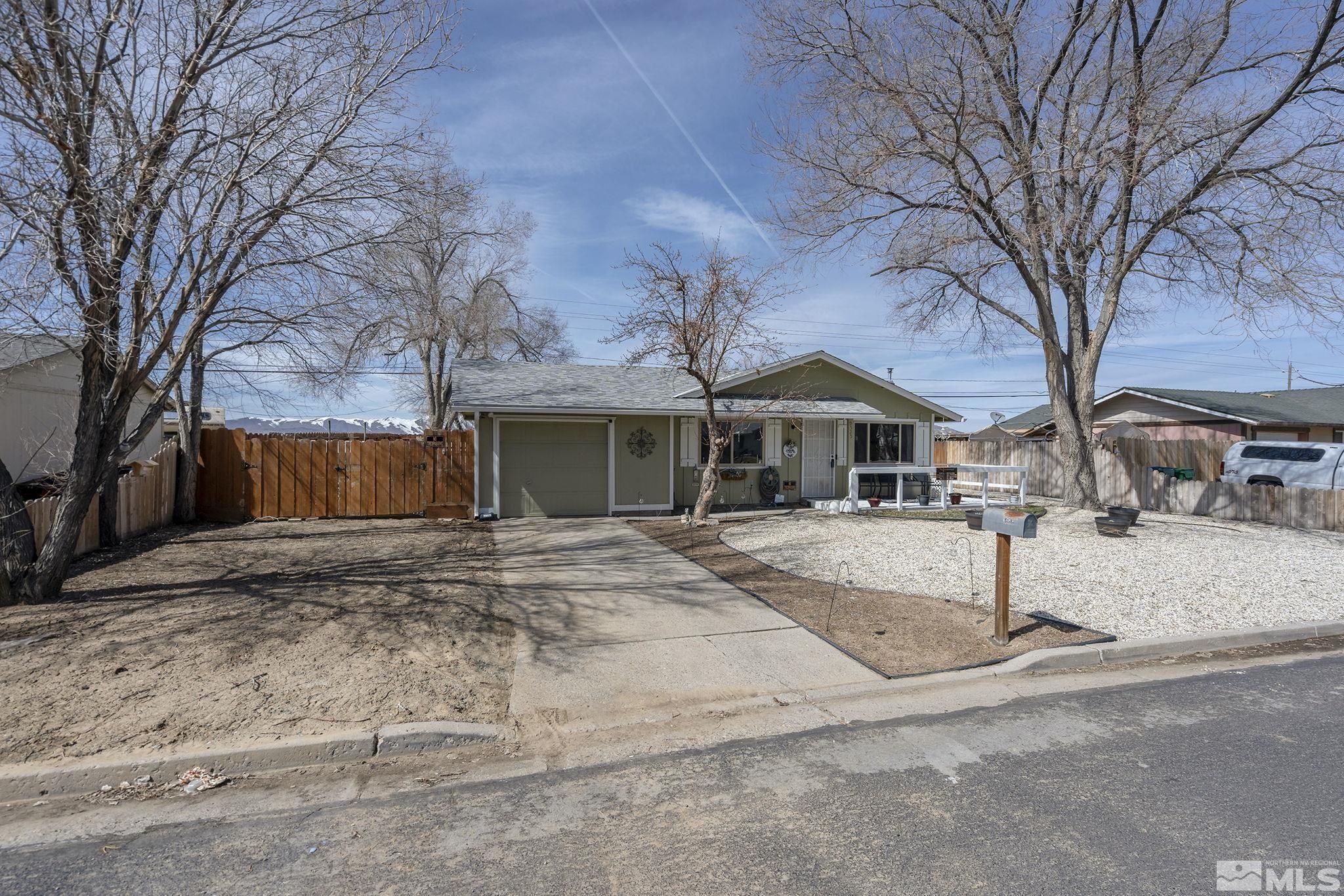 9525 Fremont Way Reno, NV 89506 - Photo 2 of 23 a front view of house with street