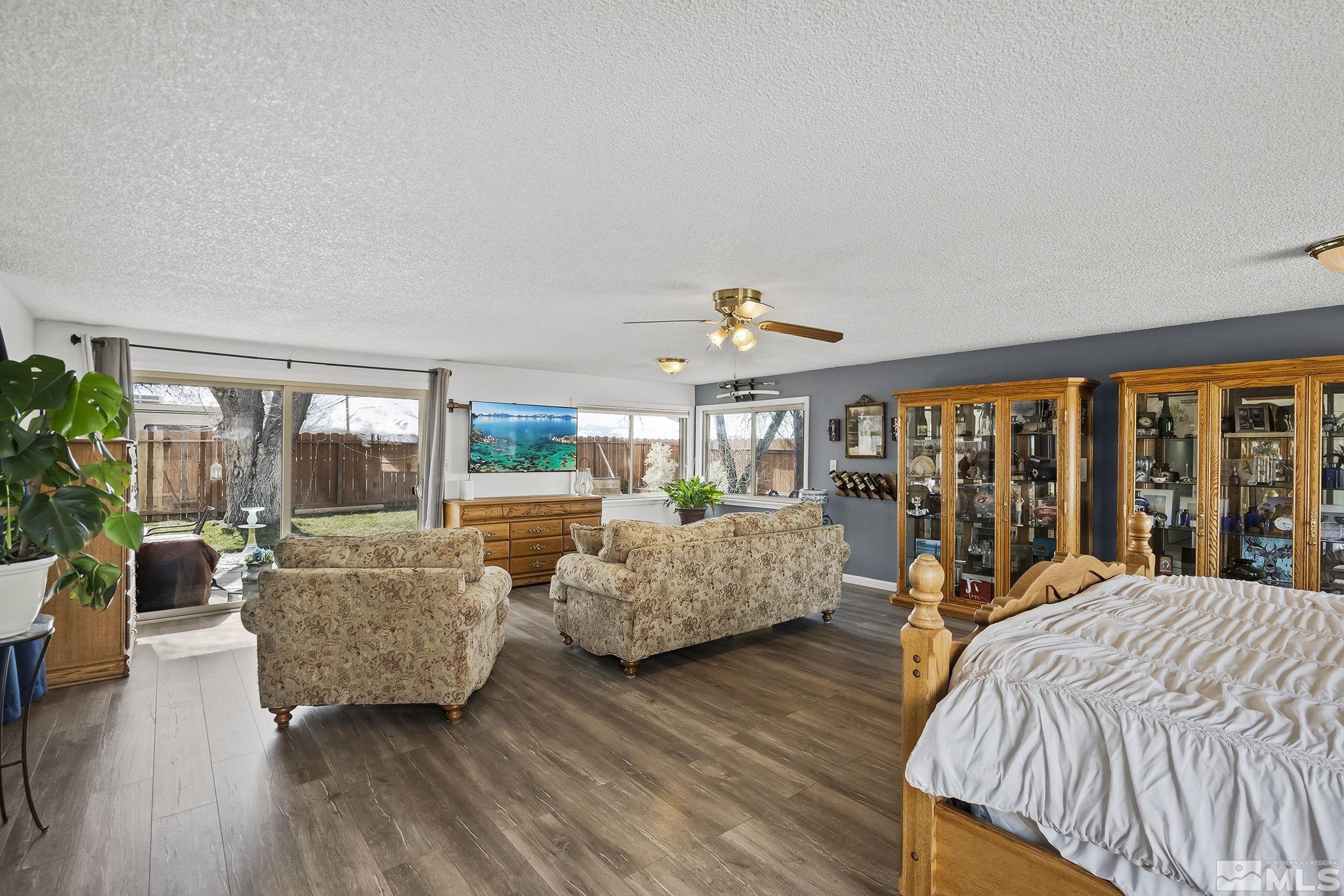 9525 Fremont Way Reno, NV 89506 - Photo 9 of 23 a bed room with furniture and a large window