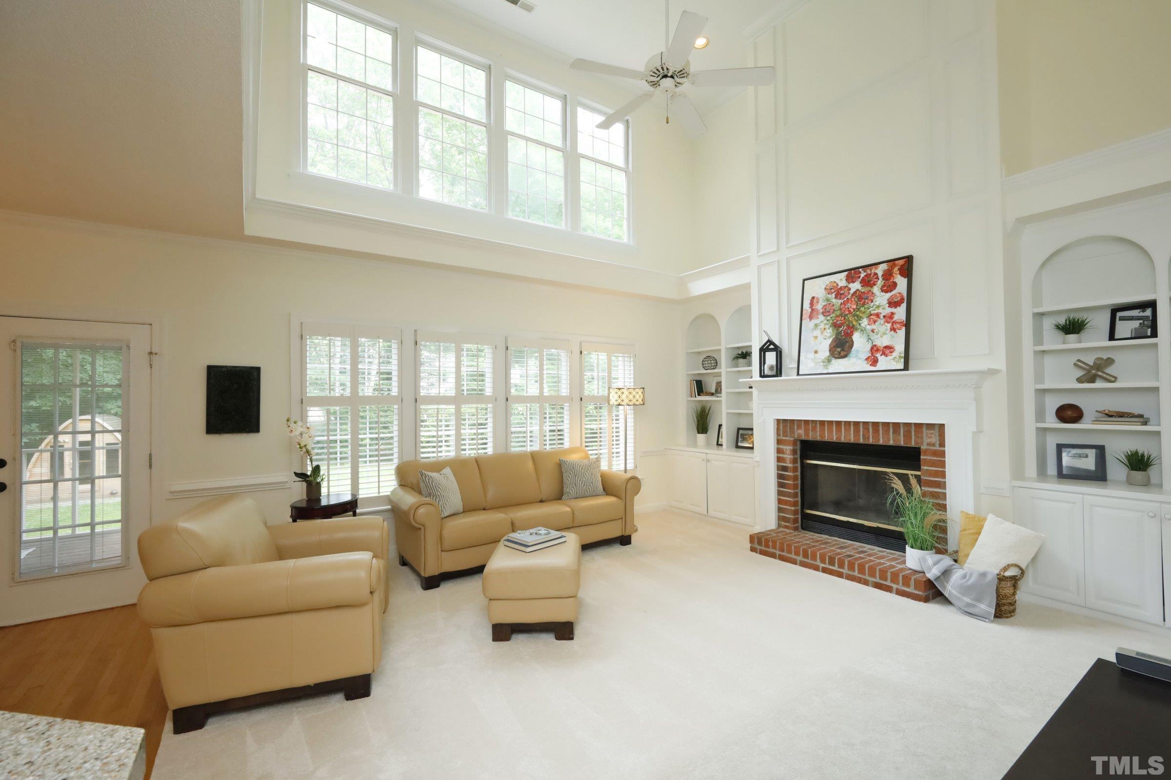 101 Modena Drive Cary, NC 27513 - Photo 14 of 57 a living room with furniture window and a fireplace