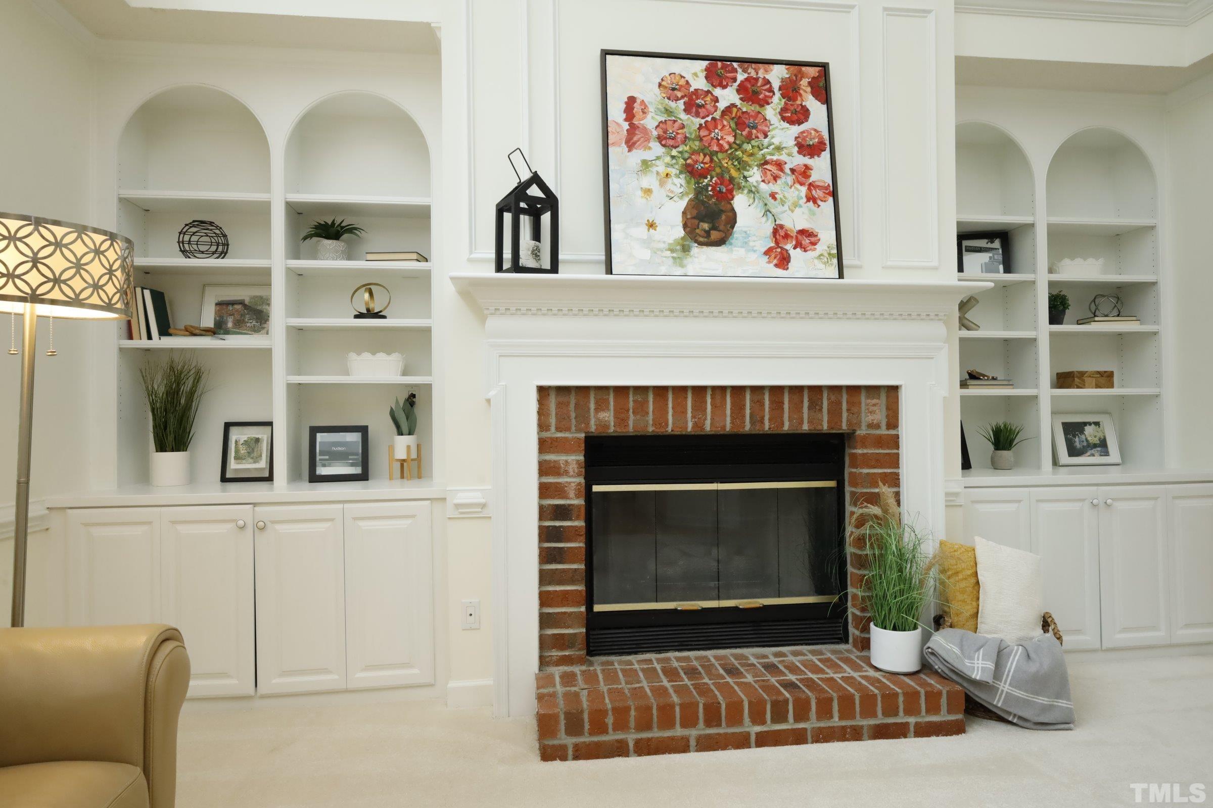 101 Modena Drive Cary, NC 27513 - Photo 16 of 57 a living room with a fireplace windows and a painting