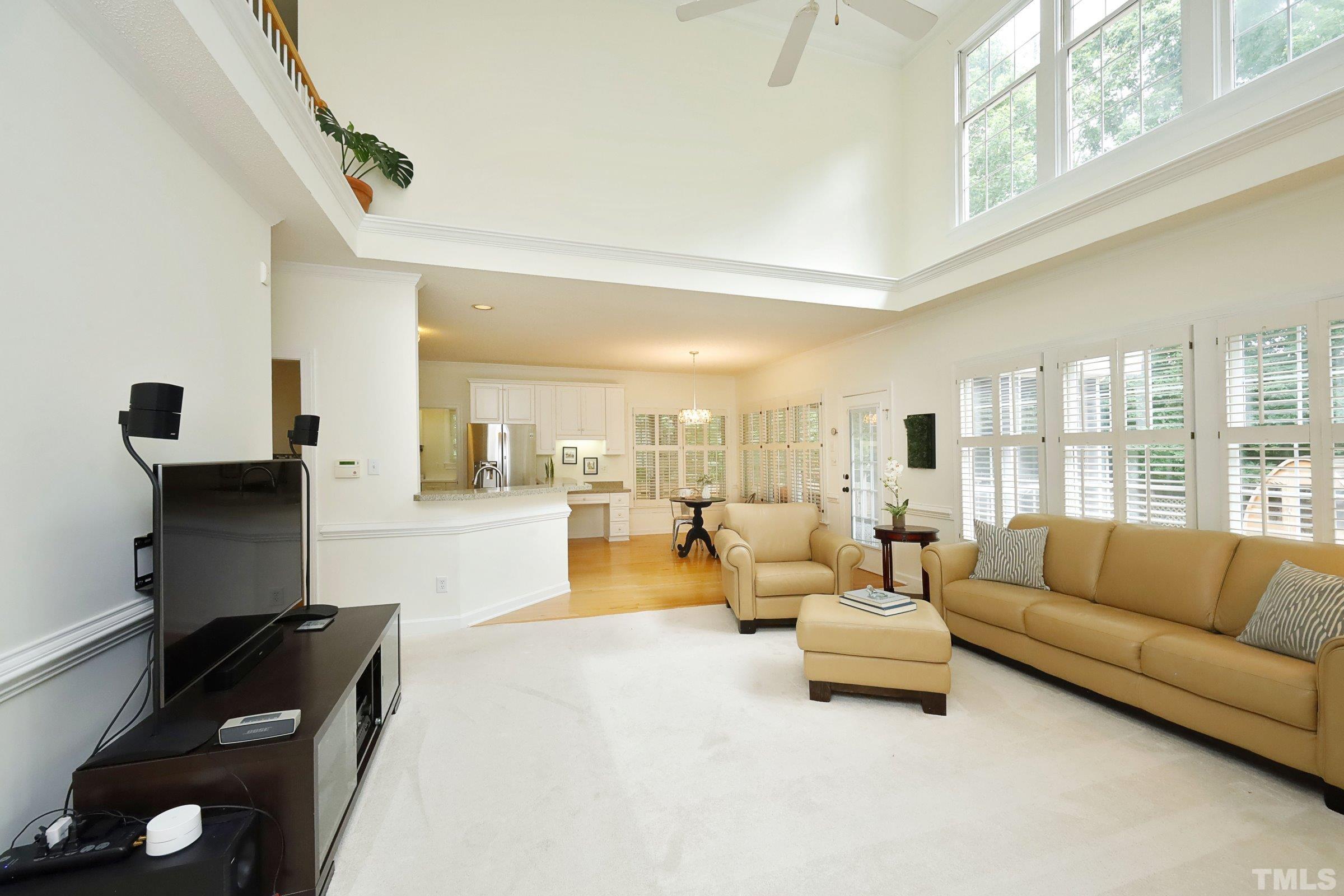 101 Modena Drive Cary, NC 27513 - Photo 18 of 57 a living room with furniture and a large window