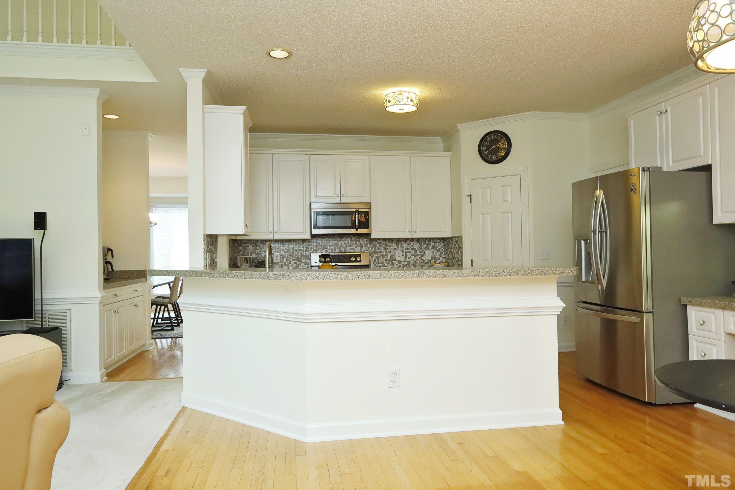 101 Modena Drive Cary, NC 27513 - Photo 22 of 57 a kitchen with a refrigerator sink and cabinets