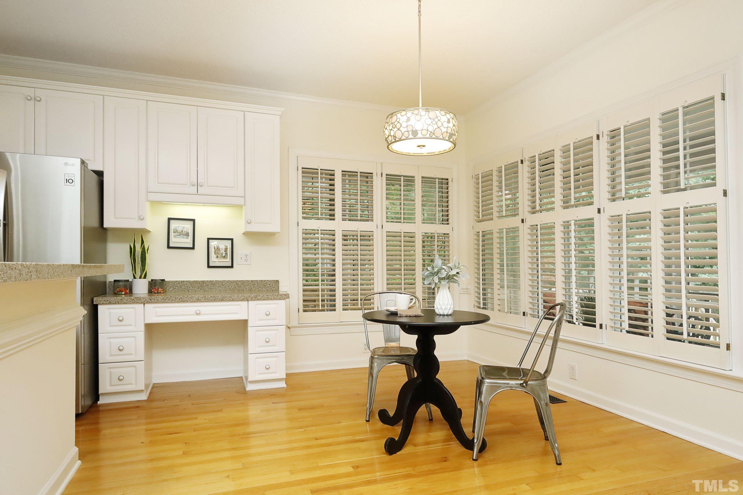 101 Modena Drive Cary, NC 27513 - Photo 23 of 57 a view of a dining room with furniture window and wooden floor
