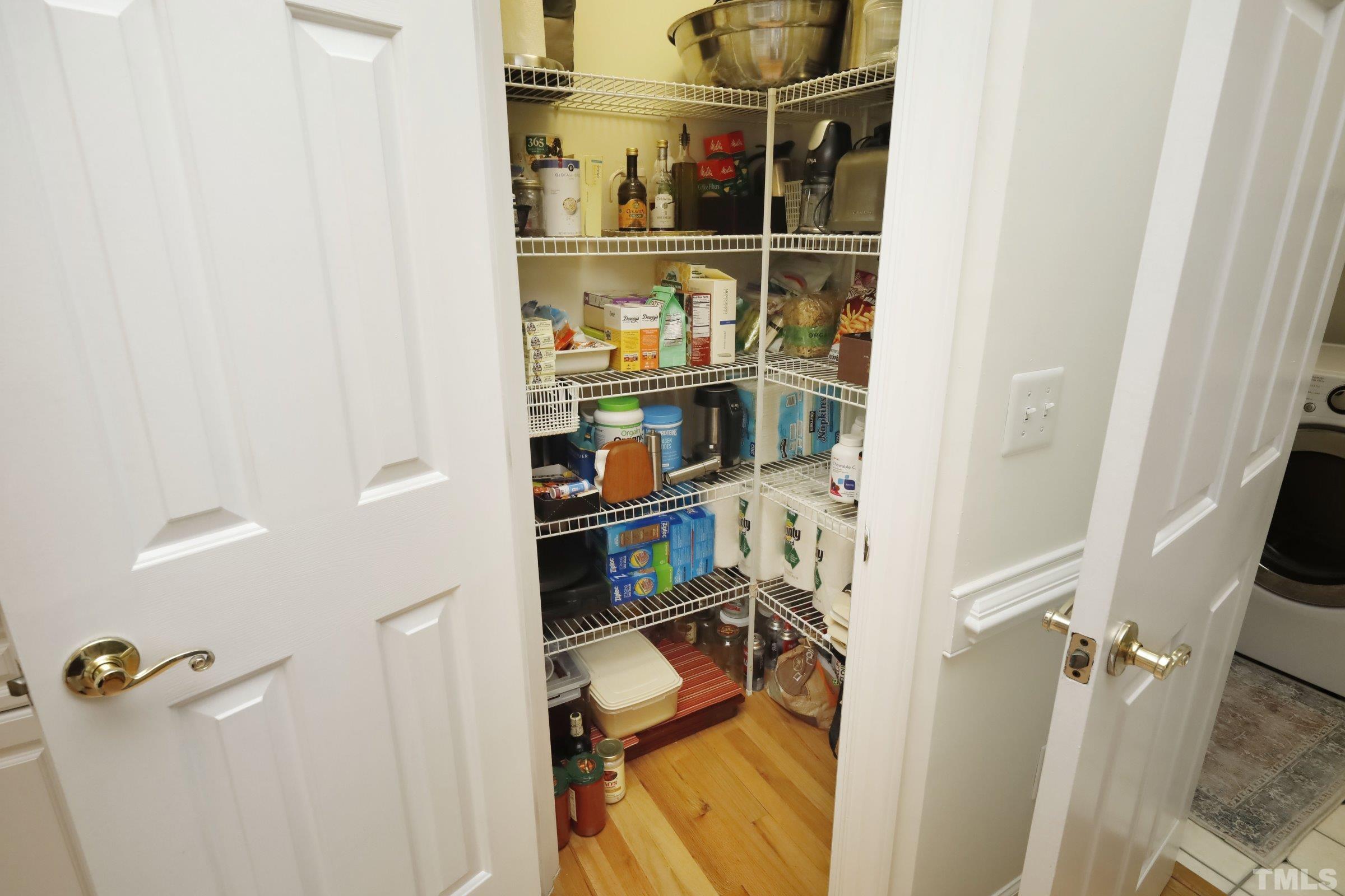 101 Modena Drive Cary, NC 27513 - Photo 25 of 57 a view of walk in closet with clothes and shoes