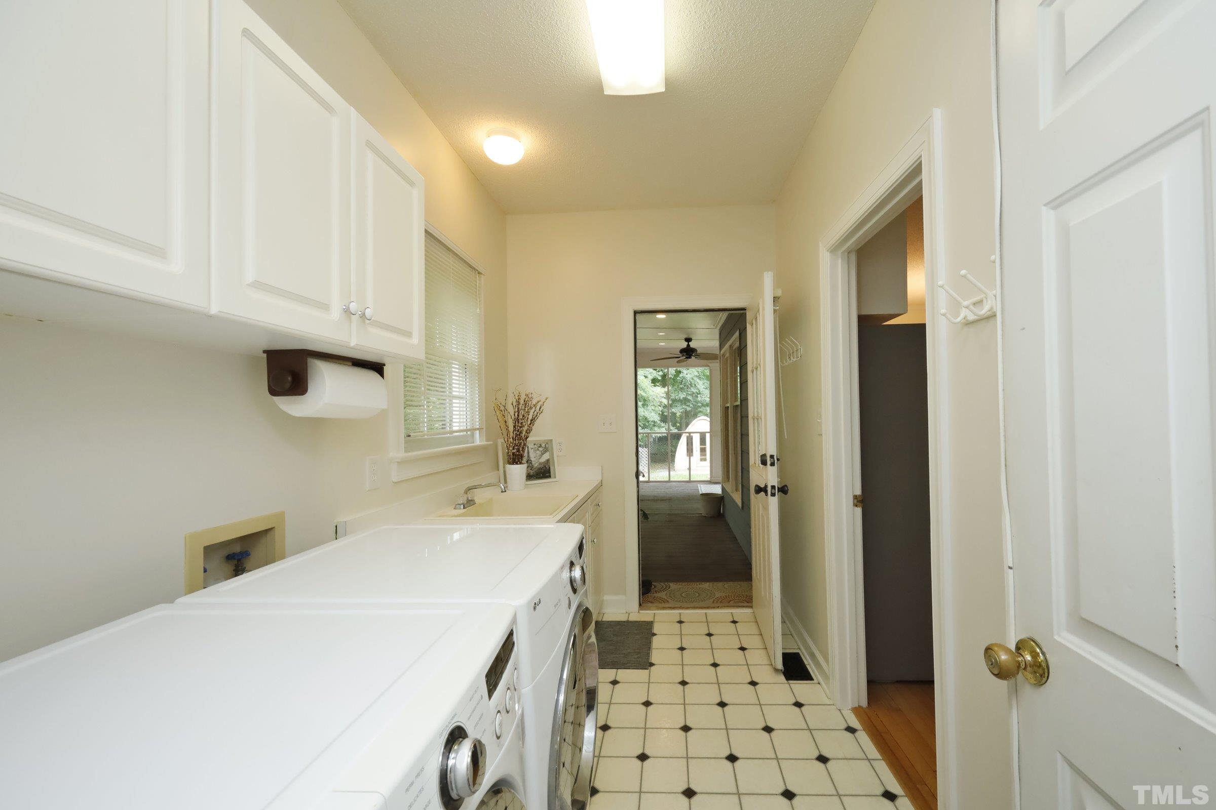101 Modena Drive Cary, NC 27513 - Photo 26 of 57 a utility room with dryer and washer