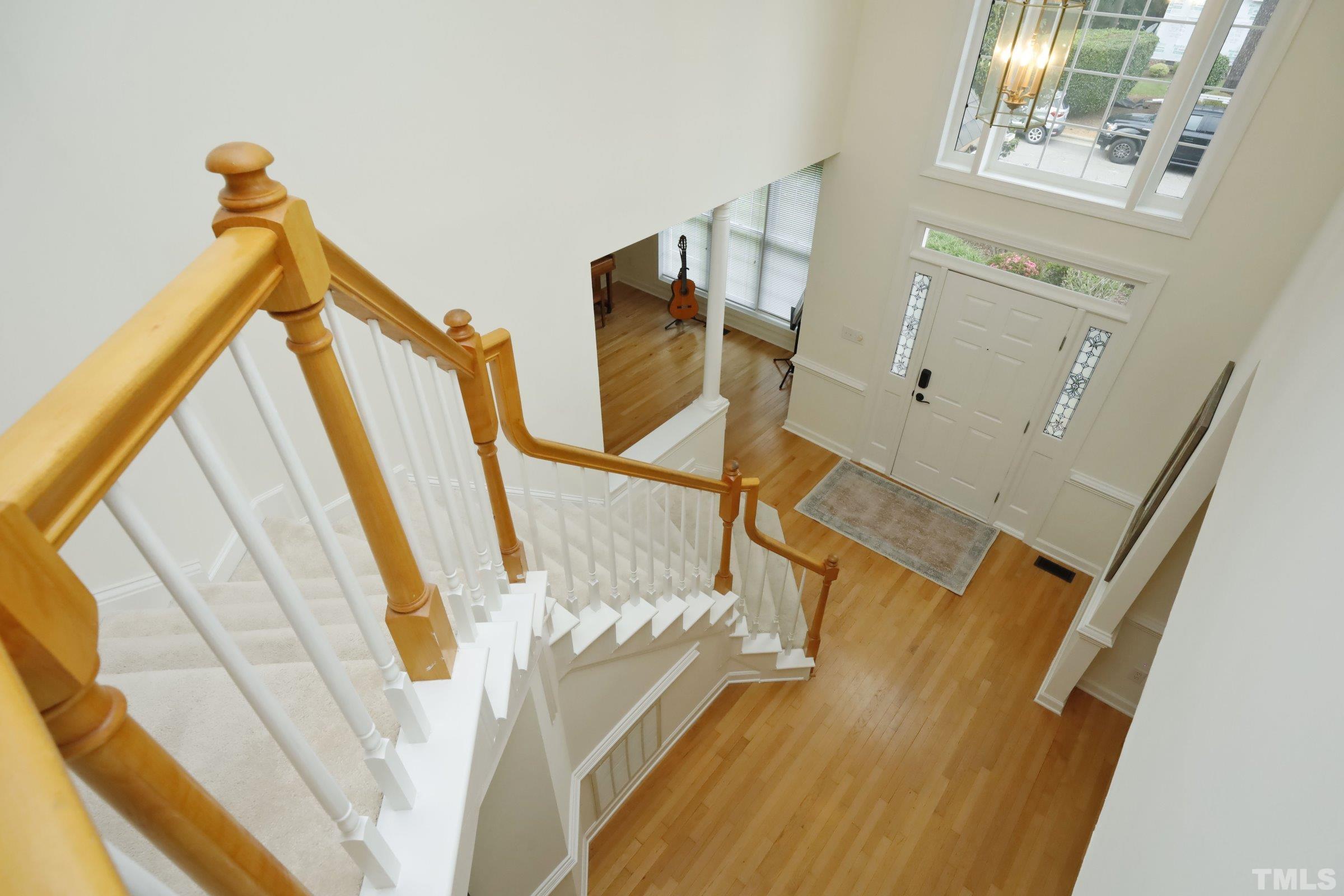 101 Modena Drive Cary, NC 27513 - Photo 28 of 57 a view of an entryway with wooden floor