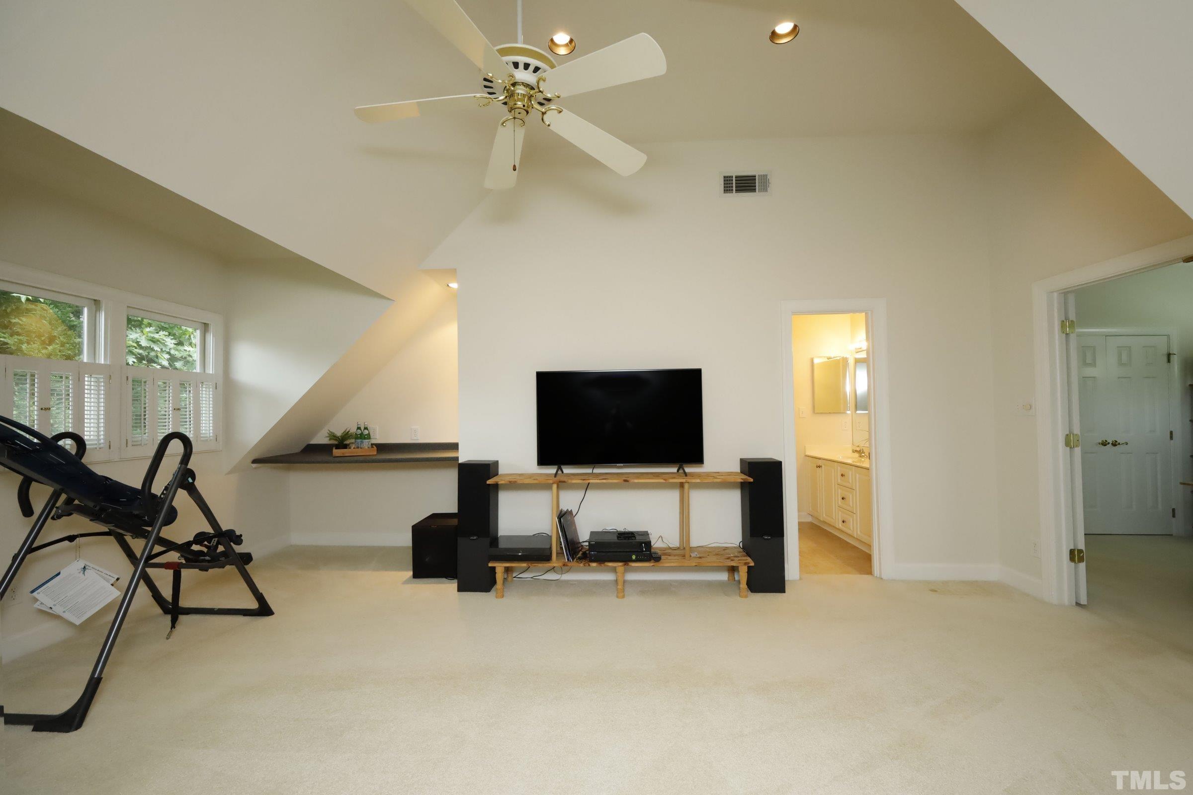 101 Modena Drive Cary, NC 27513 - Photo 34 of 57 a living room with furniture and a flat screen tv