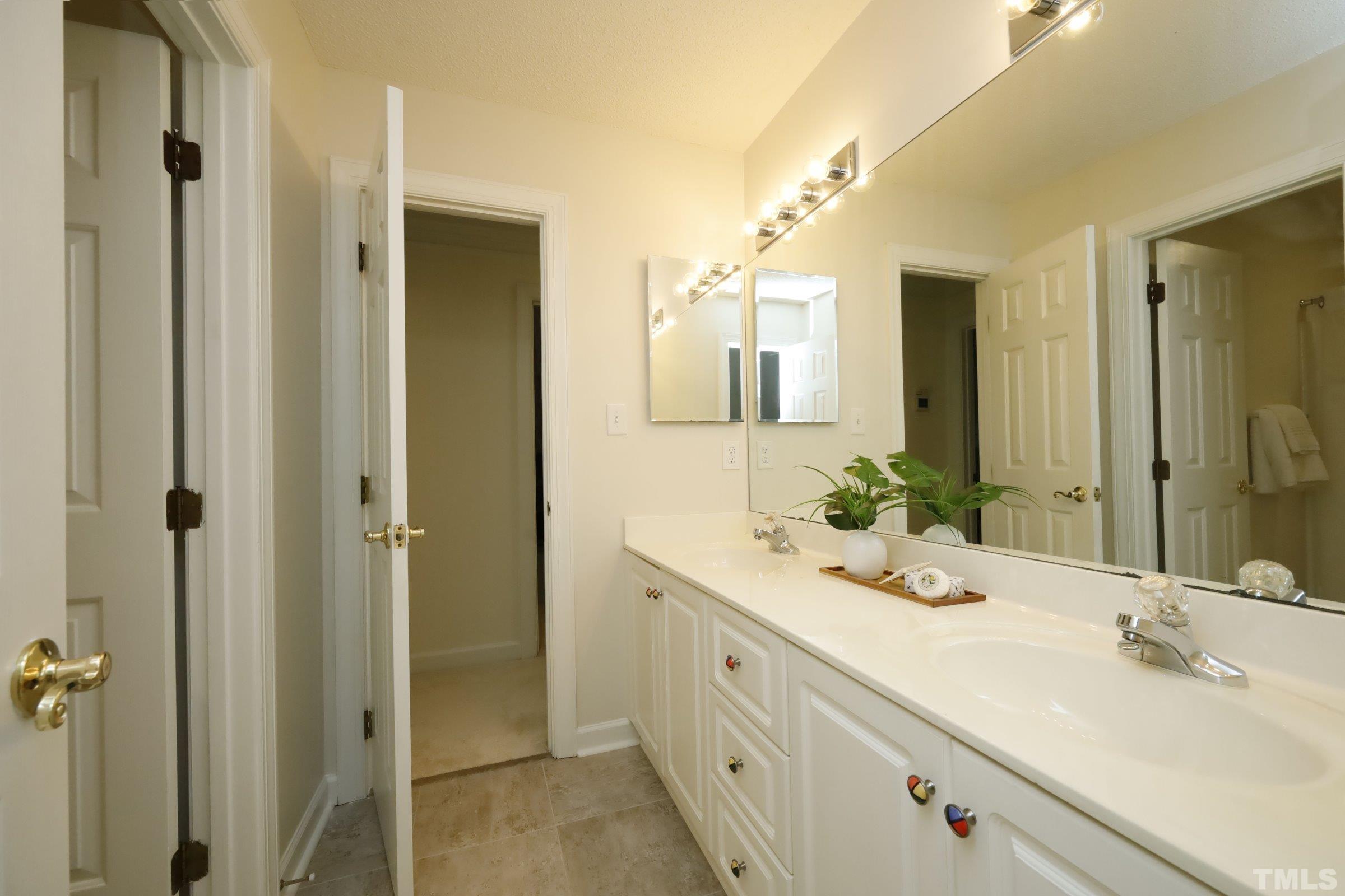 101 Modena Drive Cary, NC 27513 - Photo 36 of 57 a bathroom with a double vanity sink mirror and double