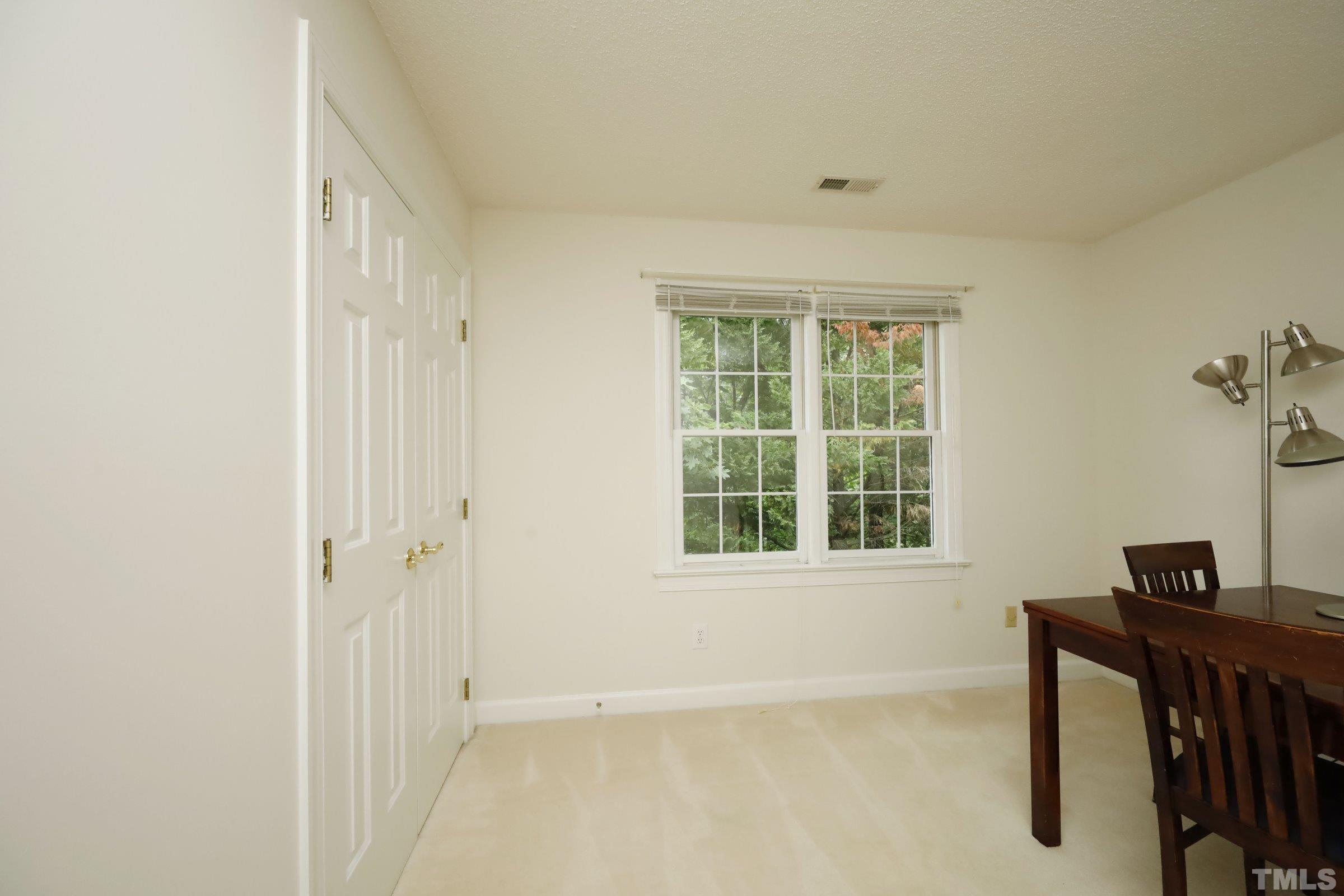 101 Modena Drive Cary, NC 27513 - Photo 38 of 57 a view of an empty room with a window