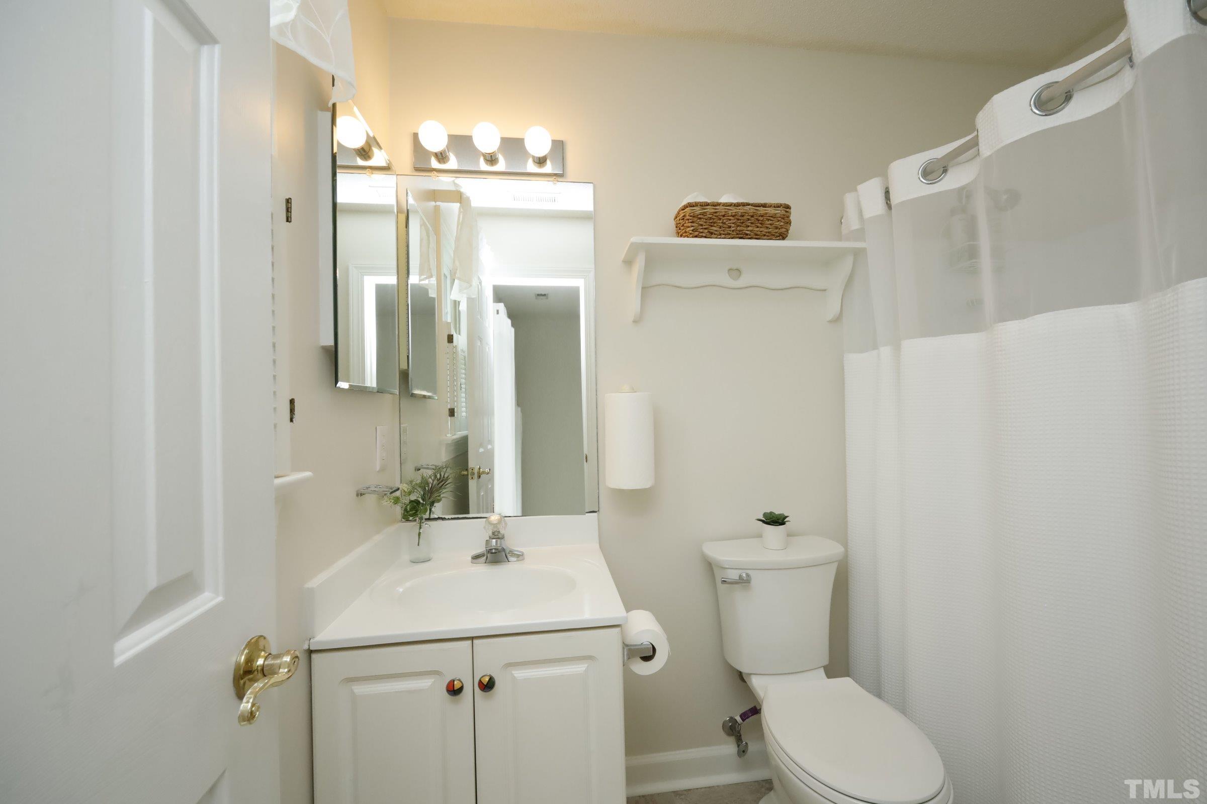 101 Modena Drive Cary, NC 27513 - Photo 40 of 57 a bathroom with a sink toilet and shower