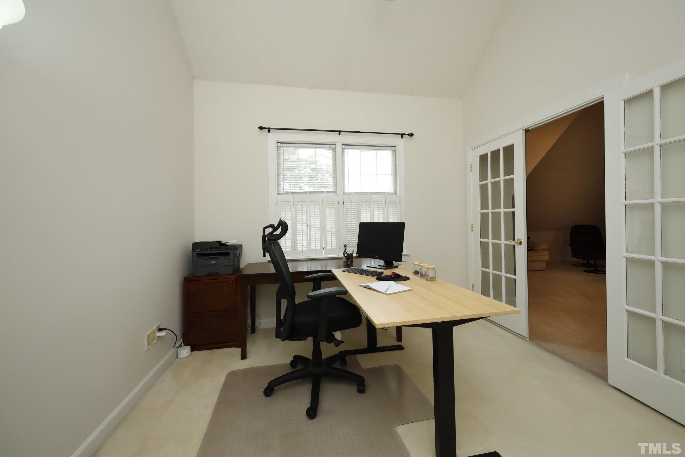 101 Modena Drive Cary, NC 27513 - Photo 41 of 57 a view of a workspace with furniture and a window