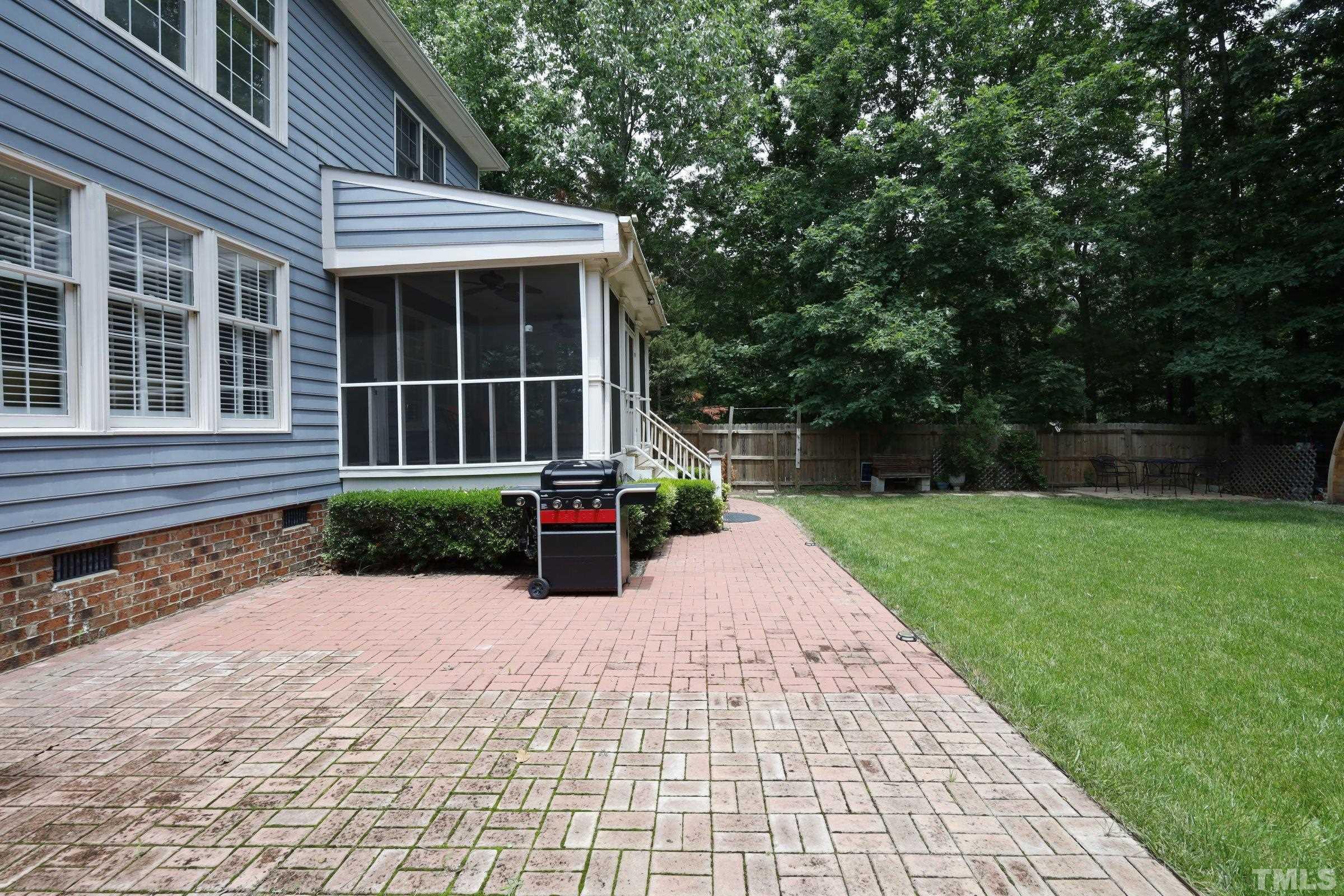 101 Modena Drive Cary, NC 27513 - Photo 50 of 57 a view of a house with a yard