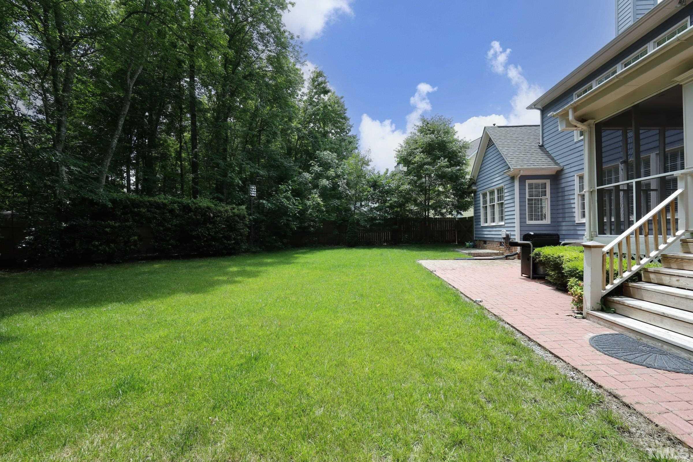 101 Modena Drive Cary, NC 27513 - Photo 55 of 57 a front view of a house with garden