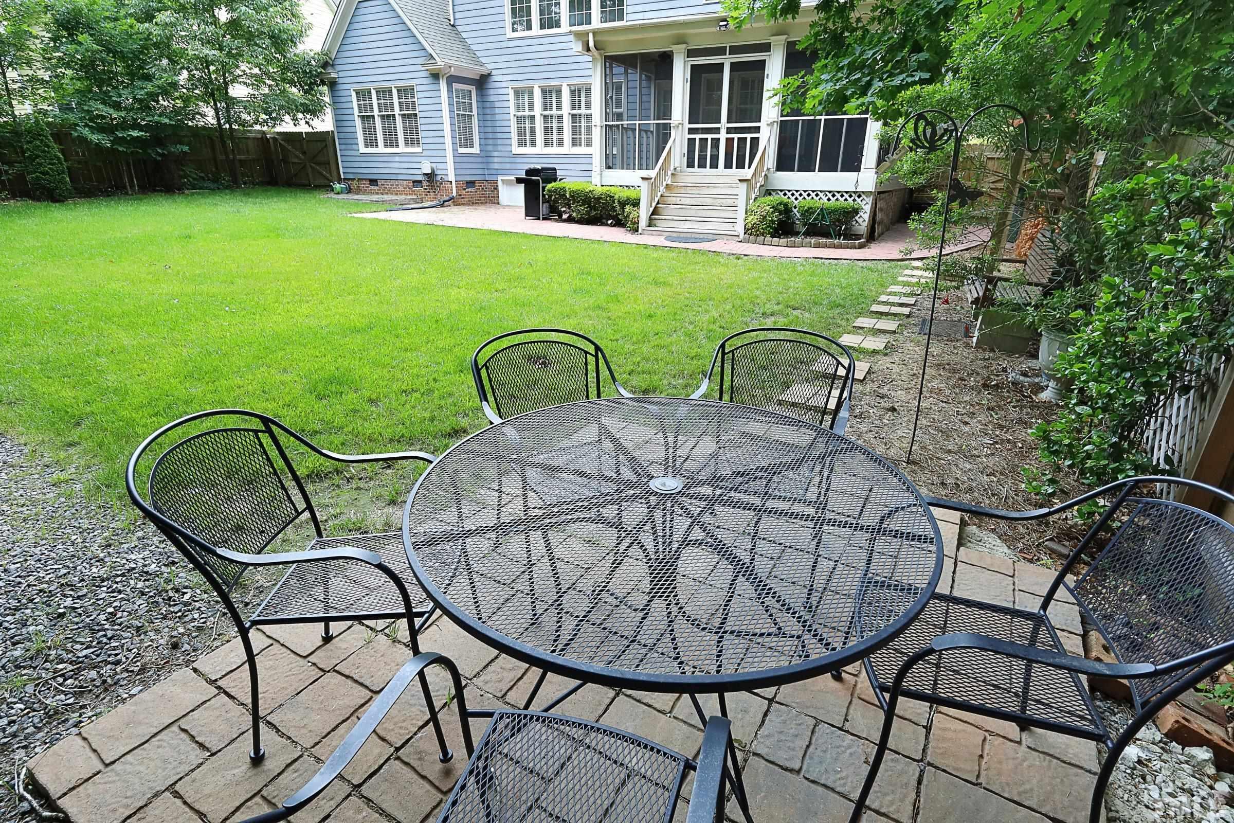 101 Modena Drive Cary, NC 27513 - Photo 56 of 57 a view of a house with backyard porch and sitting area