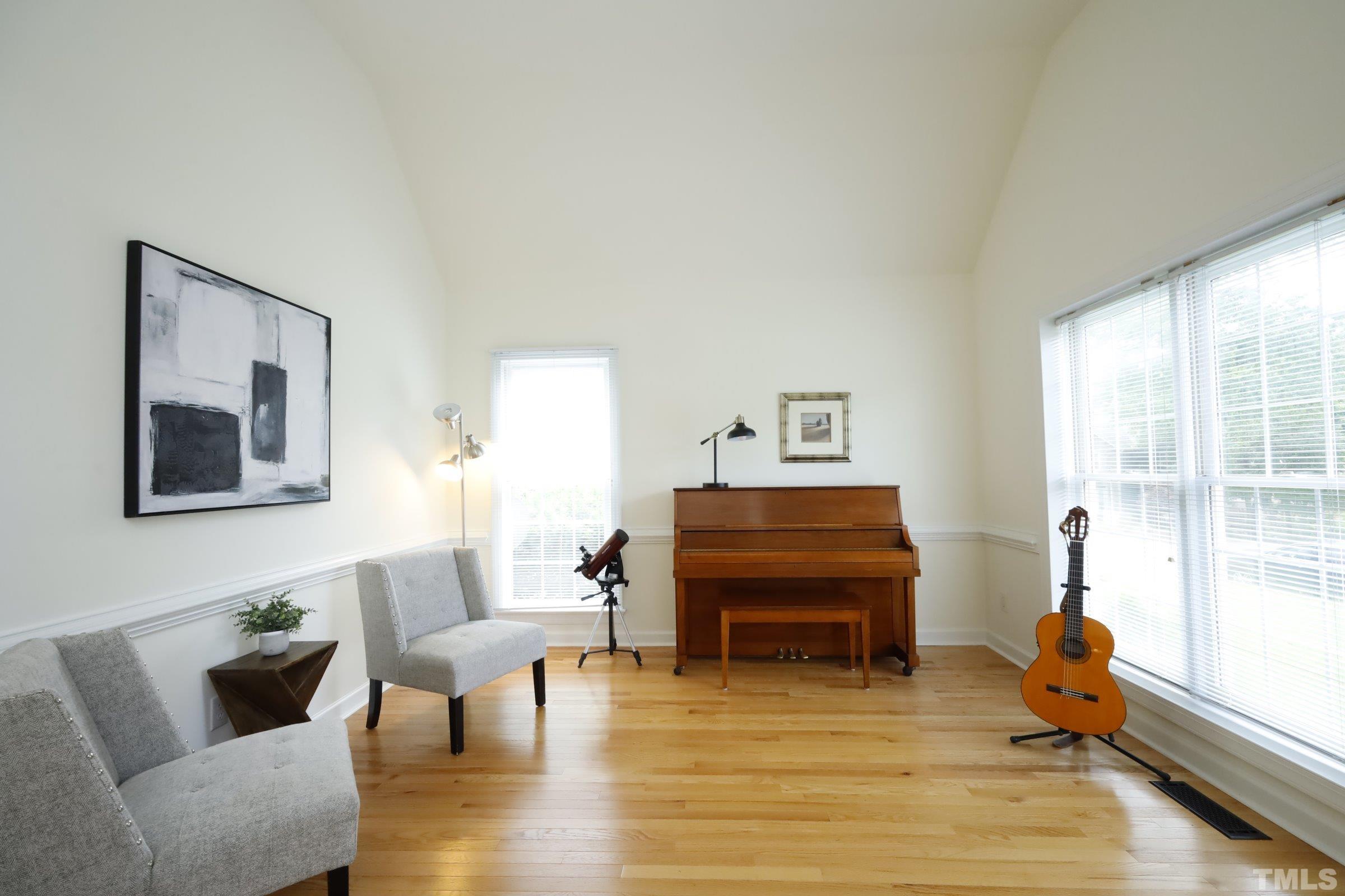 101 Modena Drive Cary, NC 27513 - Photo 8 of 57 a living room with furniture and a piano