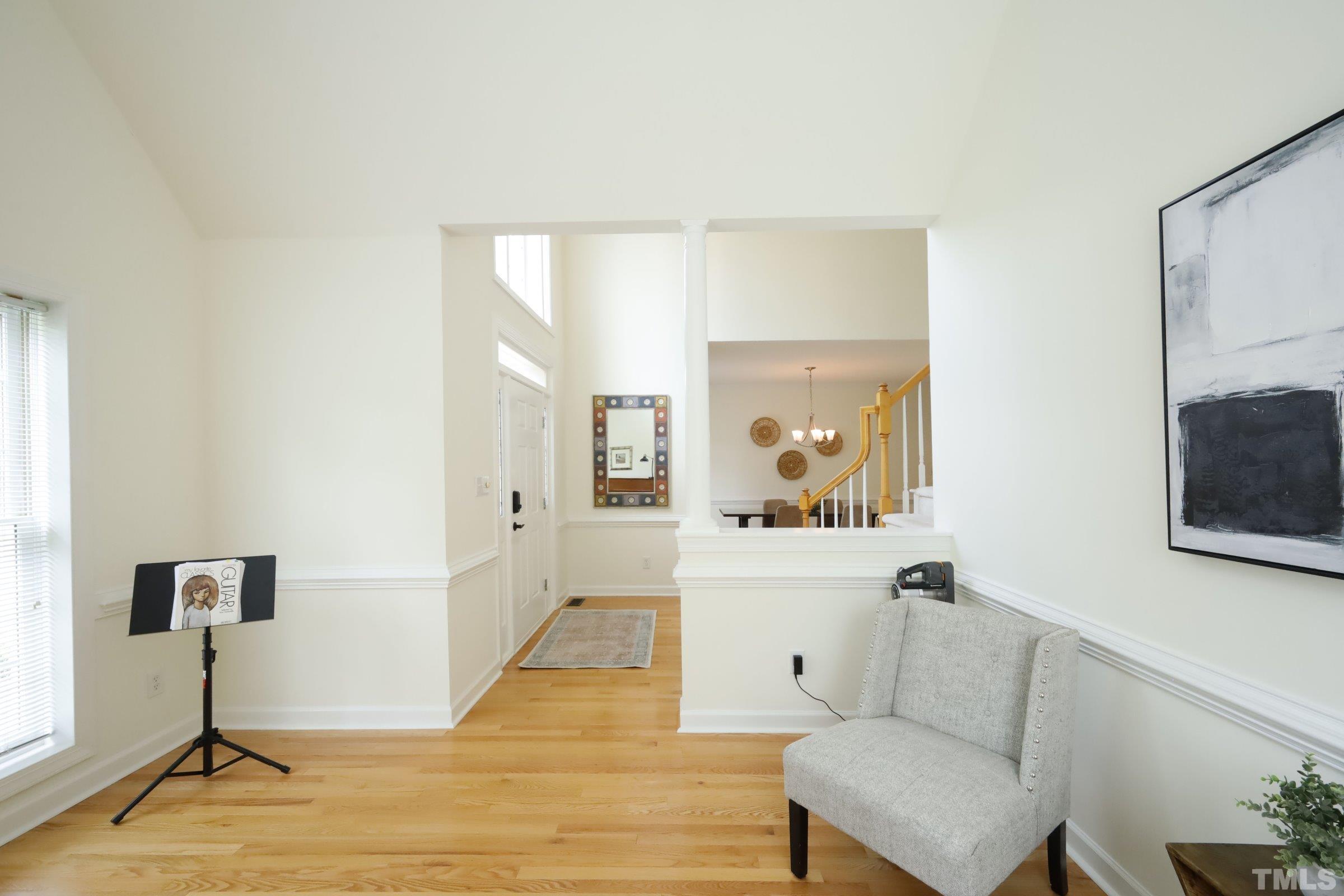 101 Modena Drive Cary, NC 27513 - Photo 9 of 57 a living room with furniture and a flat screen tv